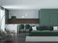 Nowoczesny salon z kuchnią w odcieniach zieleni. Seledynowy kolor ścian i mebli tworzy spokojną atmosferę.