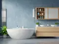 Nowoczesna łazienka z wolnostojącą wanną i drewnianą szafką z umywalkami. Betonowa ściana i podłoga to świetne pomysły co zamiast płytek w łazience.