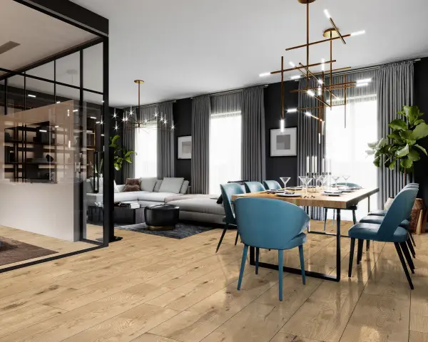 Nowoczesny salon z jadalnią, gdzie drewniana podłoga kronostep tworzy ciepłą bazę dla eleganckich mebli i designerskiego oświetlenia.