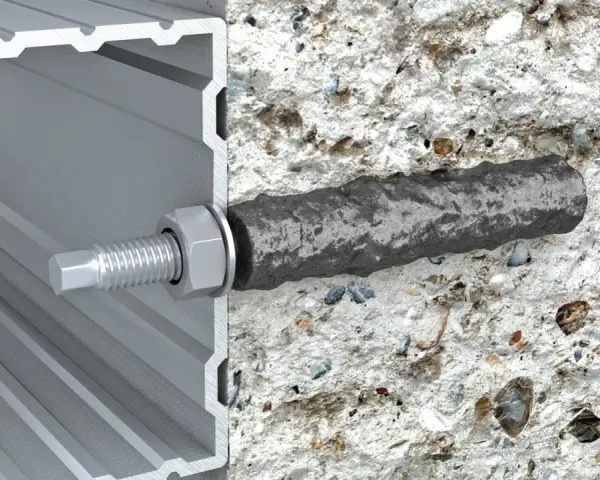 Przekrój pokazuje, jak kotwy chemiczne mocują profil aluminiowy do betonu. Solidne połączenie dla trwałej konstrukcji.