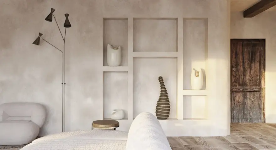 Wnętrze w stylu wabi sabi: surowe tynki, drewniane belki, rustykalne drzwi i minimalistyczne dekoracje tworzą spokojną atmosferę.
